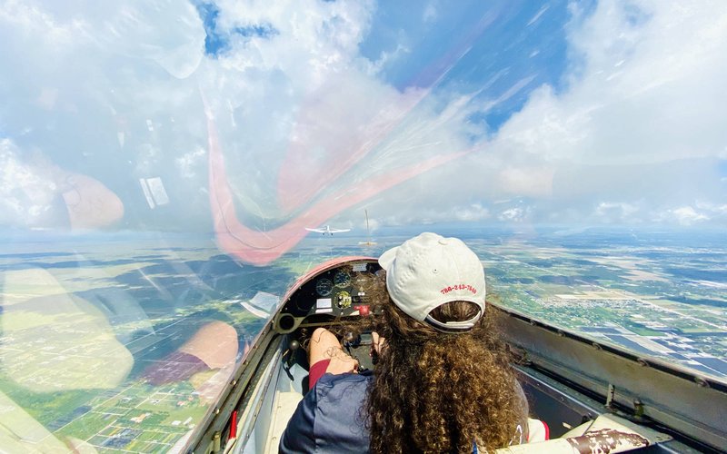 Student pilot at the controls of a Miami Gliders sailplane in flight over South Florida