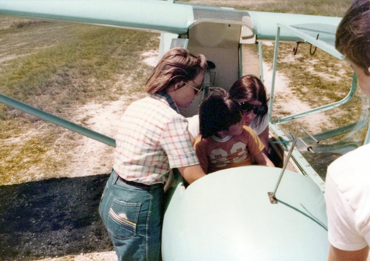 Family in a glider, vintage photograph