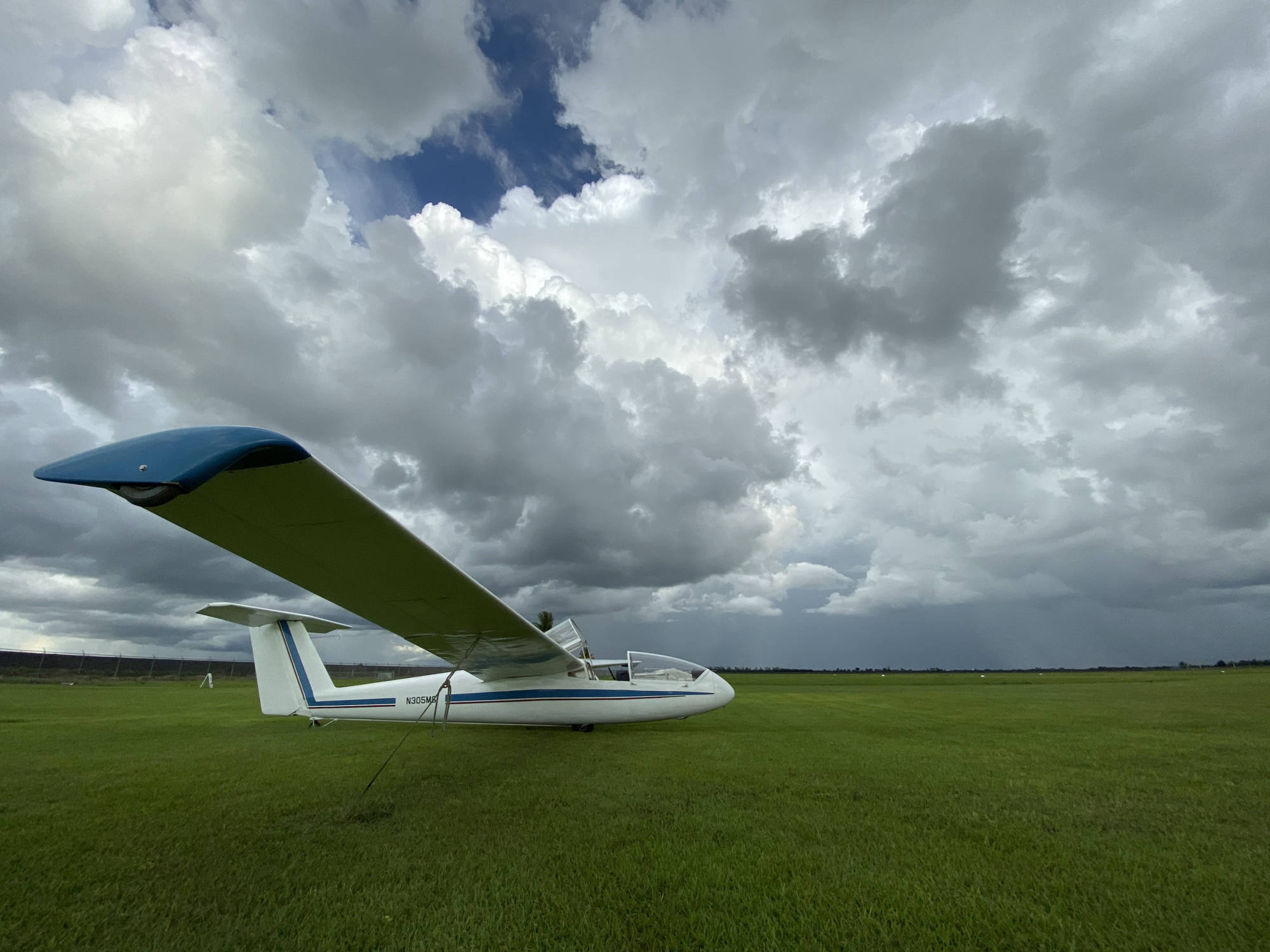 Glider tied down, waiting for the rain to pass