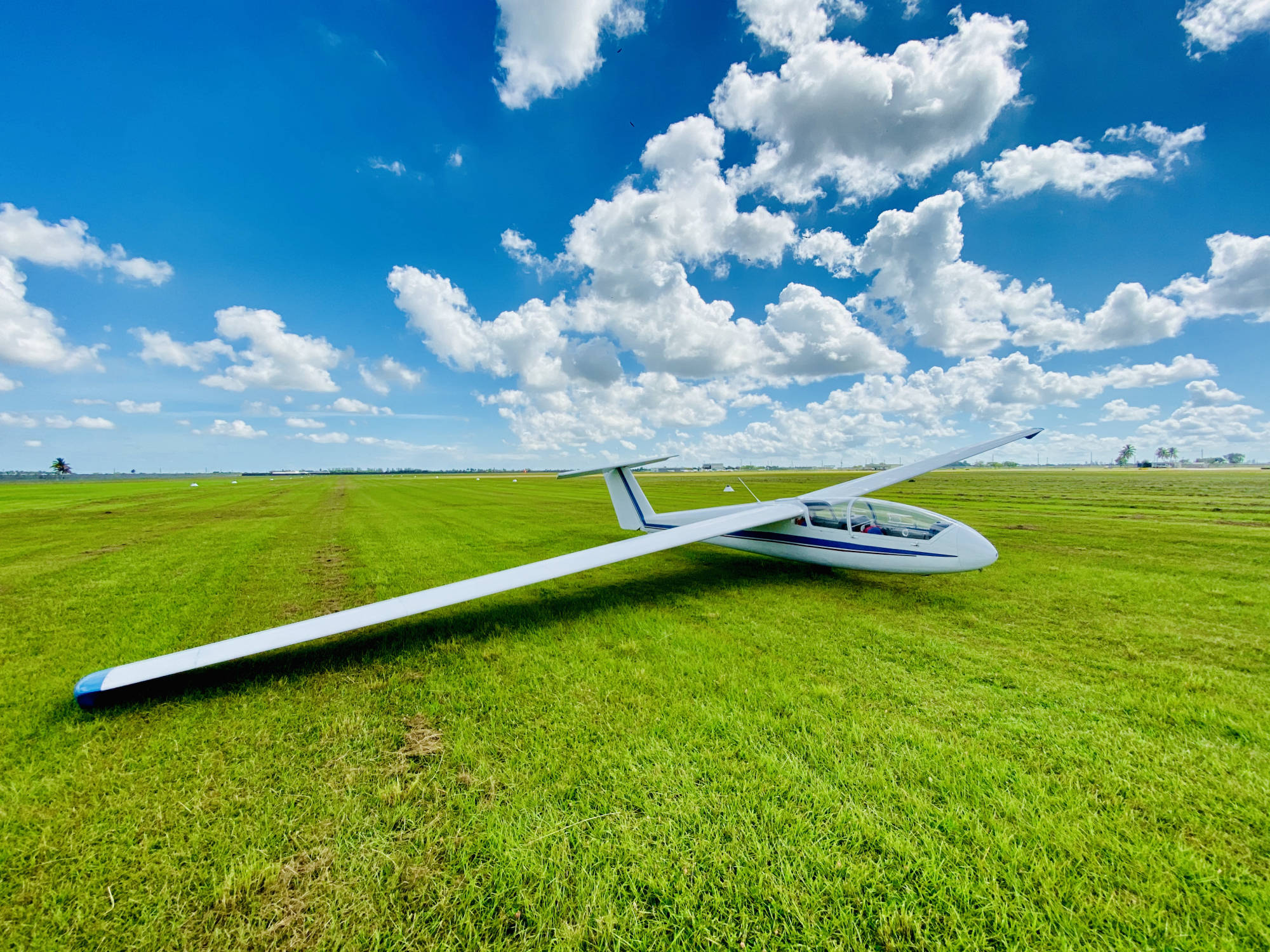 Glider soaring over South Florida at golden hour